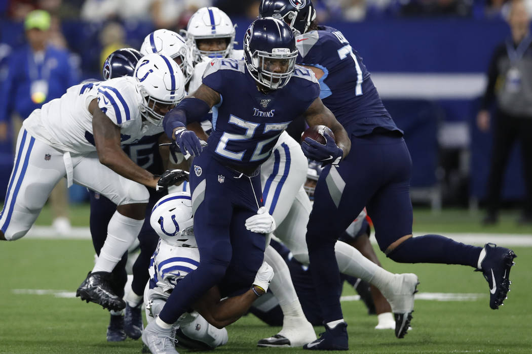 Tennessee Titans running back Derrick Henry (22) runs the ball against the Indianapolis Colts d ...