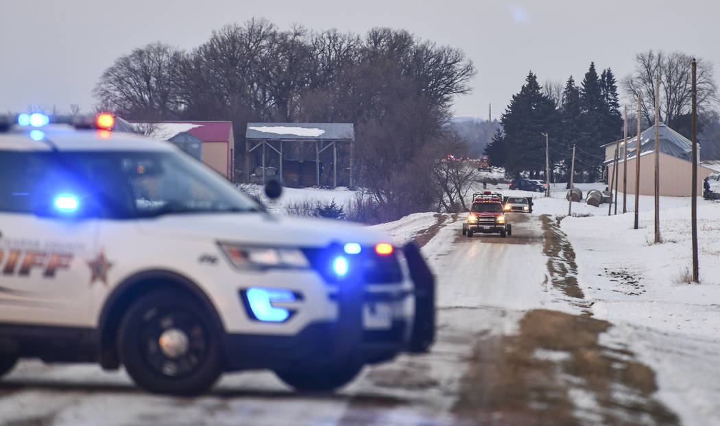 Emergency vehicles gather near the scene of a reported helicopter crash Thursday, Dec. 5, 2019, ...