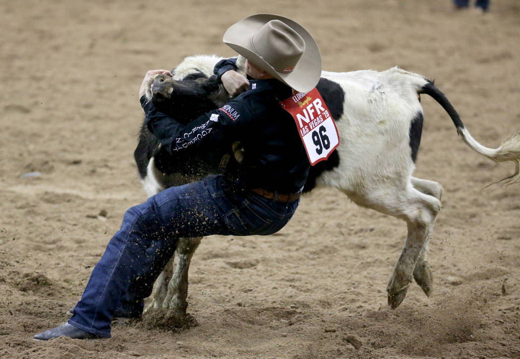 Dakota Eldridge of Elko competes in Steer Wrestling during the second go-around of the Wrangler ...