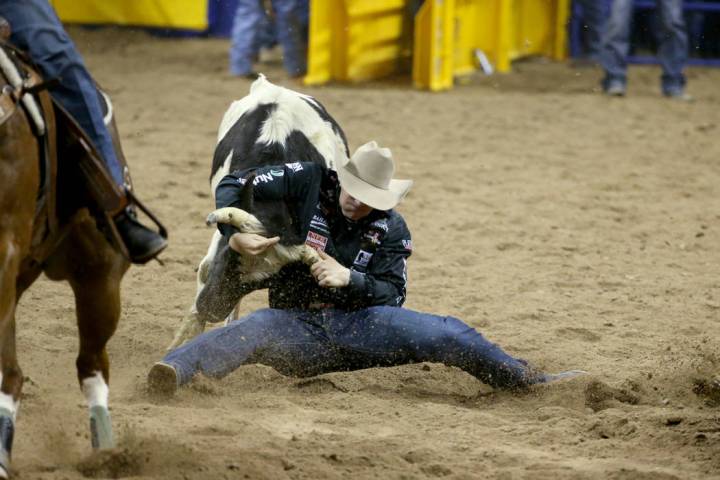 Dakota Eldridge of Elko competes in Steer Wrestling during the second go-around of the Wrangler ...