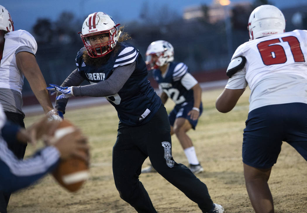 Liberty High School offensive linebacker Toa Tai (10) runs scenarios during football practice a ...