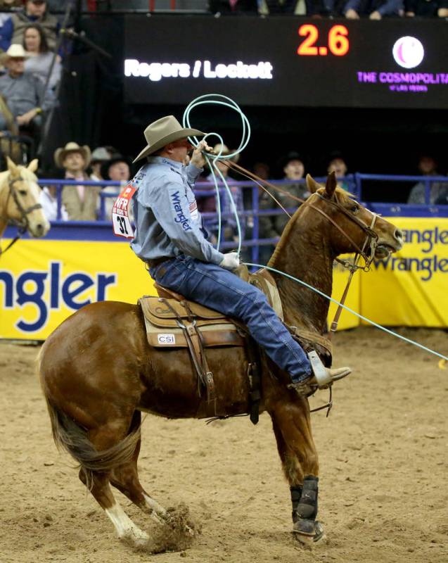 Kyle Lockett of Visalia, Calif. competes in Team Roping with Erich Rogers of Round Rock, Ariz. ...