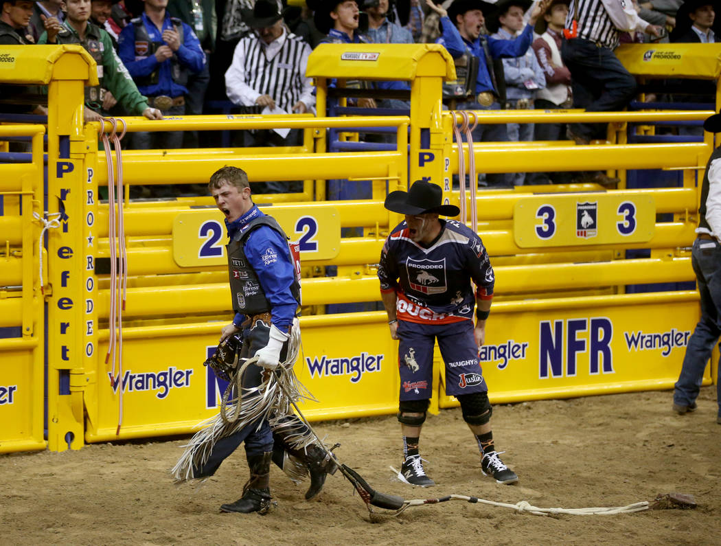 Bull rider Stetson Wright of Milford, Utah, celebrates his 92.5 ride on Monte Walsh which won t ...