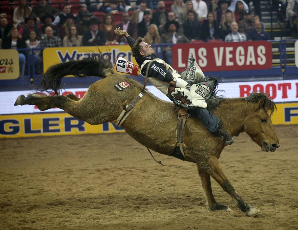 Austin Foss of Terrebonne, Ore. rides Painted River to a score of 86 in the Bareback Riding com ...