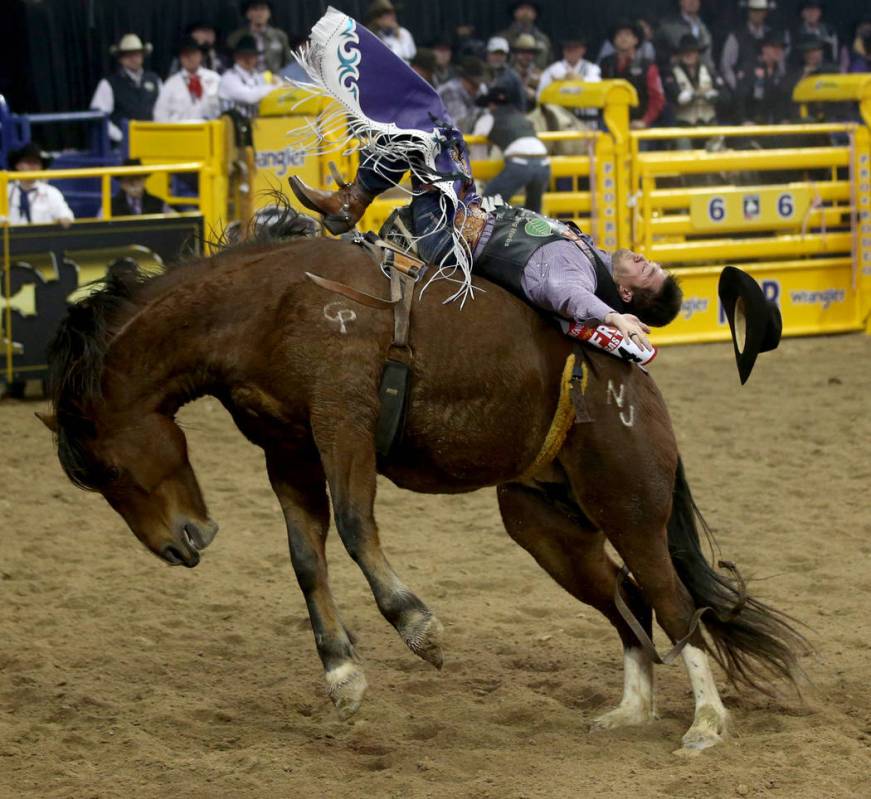 Caleb Bennett of Corvallis, Mont. rides Top Egyptian to a score of 90 points in the Bareback Ri ...