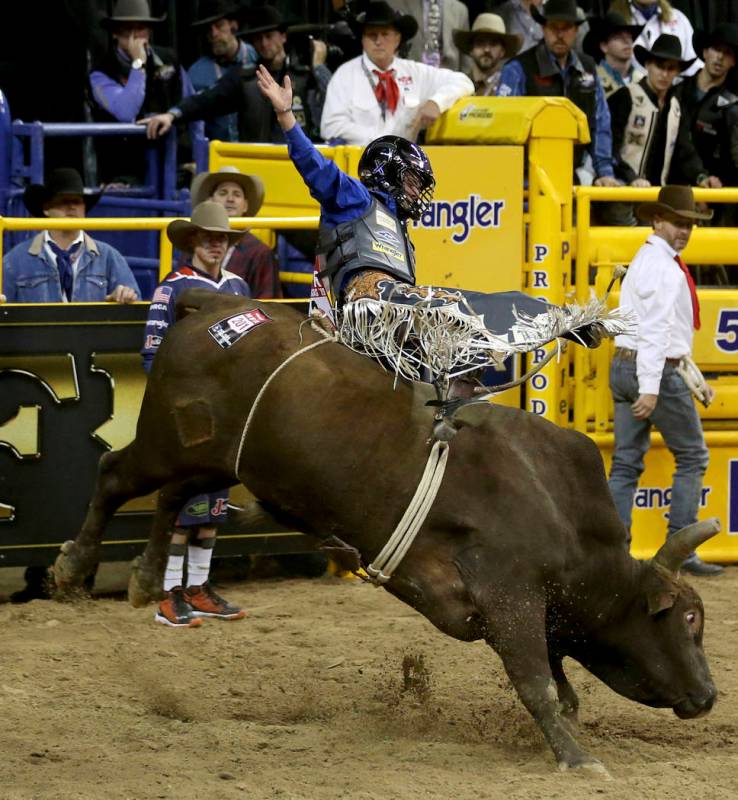 Stetson Wright of Milford, Utah, rides Monte Walsh to a score of 92.5 to win the first go-aroun ...