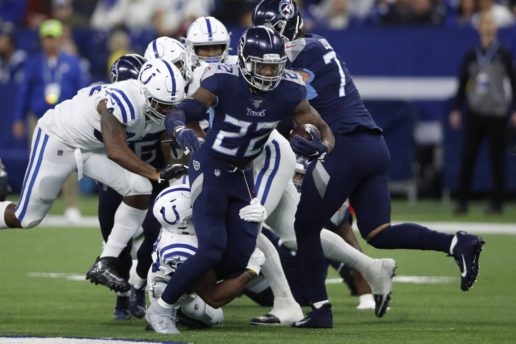 Tennessee Titans running back Derrick Henry (22) runs the ball against the Indianapolis Colts d ...