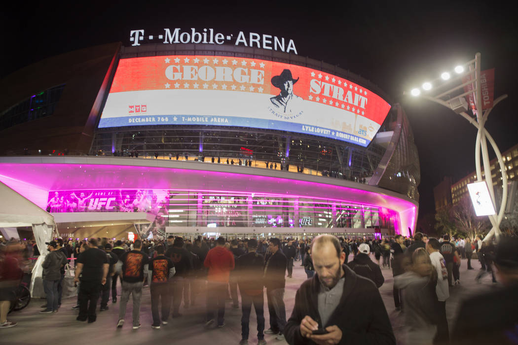 Concertgoers line up outside T-Mobile Arena before the start of the Metallica show on Monday, N ...