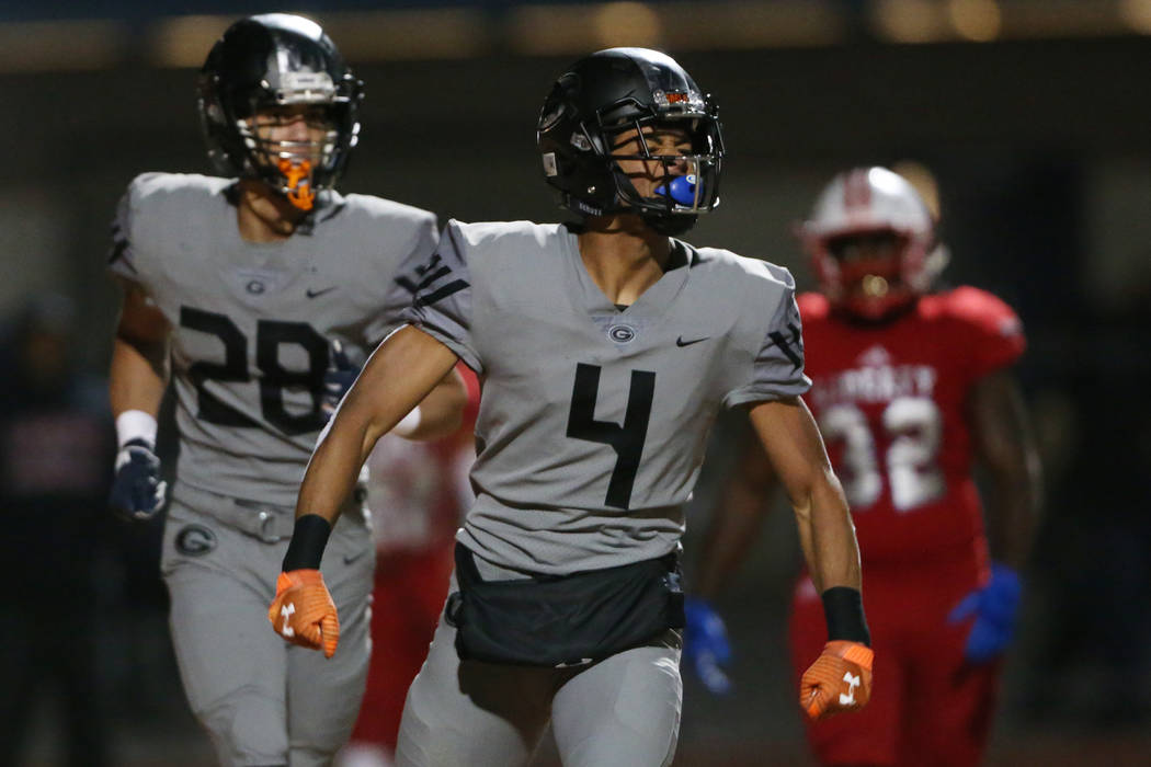 Bishop Gorman's Rome Odunze (4) celebrates a touchdown catch, with Izaiah Halmos (28), in the f ...