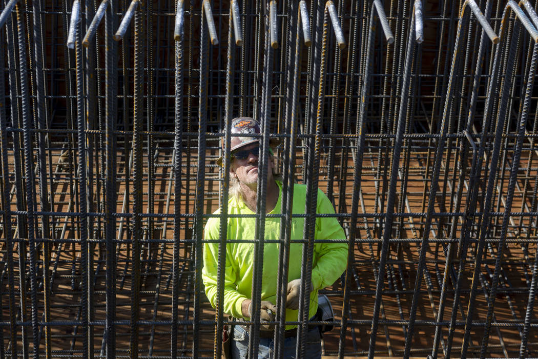 Scott McBride installs rebar on the Centennial Bridge connecting U.S. Highway 95 northbound to ...