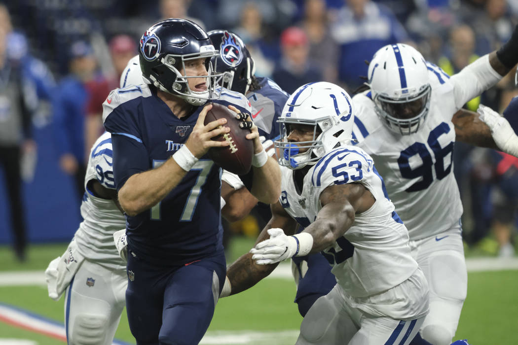Indianapolis Colts defensive end Ben Banogu (52) sacks Tennessee Titans quarterback Ryan Tanneh ...