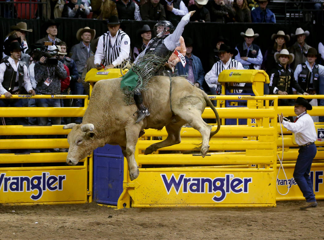 Jeff Askey of Athens, Texas, rides Yellow Fever during Bull Riding in the second go-around of t ...