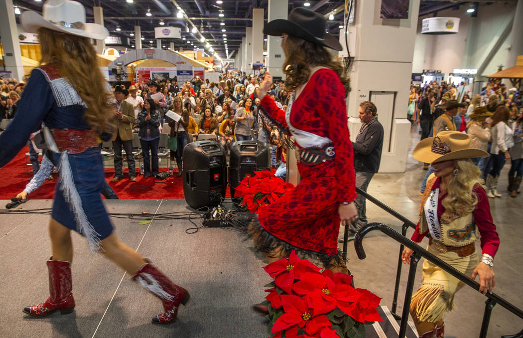 Contestants take the stage following the Miss Rodeo America Justin Boot Parade during Cowboy Ch ...