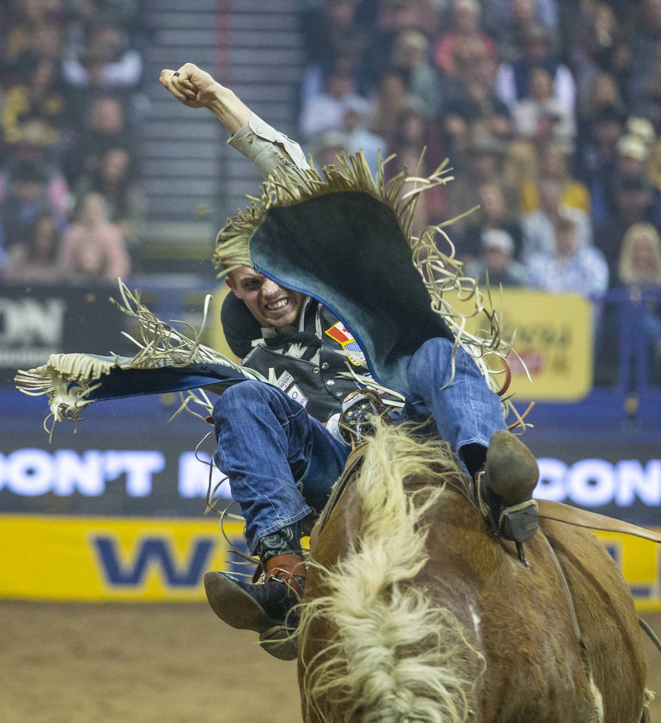 Orin Larsen of Inglis, Manitoba, rides Illegal smile in Bareback Riding during the third go-aro ...