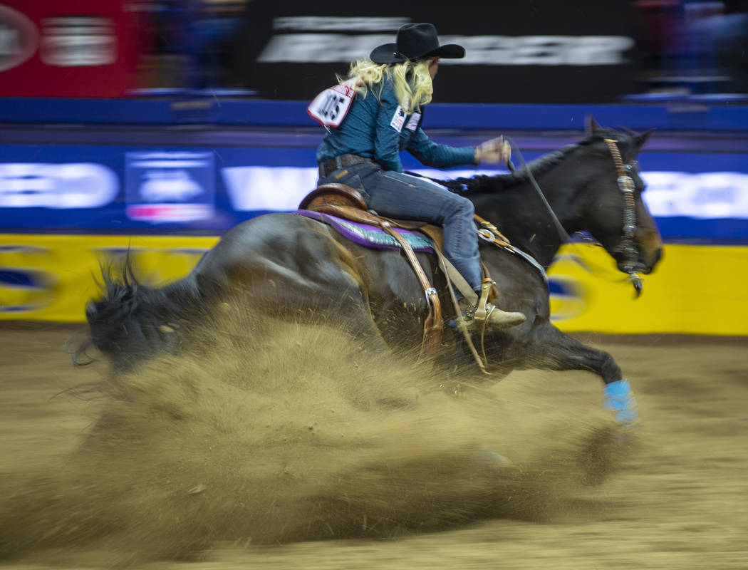 Amberleigh Moore of Salem, Oregon, nears another barrel while taking first place in Barrel Raci ...