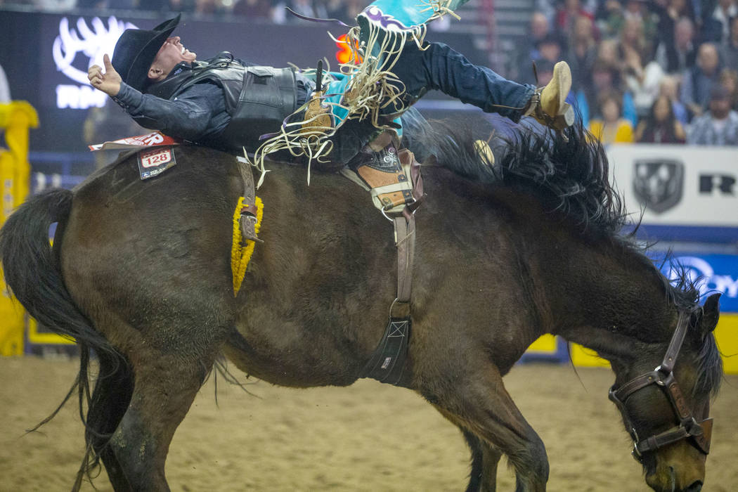 Tanner Aus of Granite Falls, Minn., rides Full Baggage to a first place score of 90 in Bareback ...