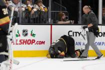 Vegas Golden Knights center Cody Glass (9) crouches in pain during the second period of the gam ...