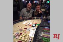 Michael and Elena Barrows of California celebrate Michael's winning Face Up Pai Gow progressive ...