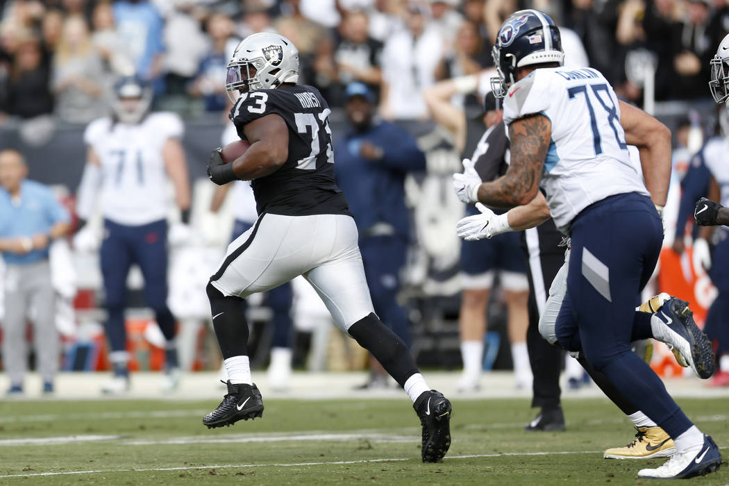 Oakland Raiders defensive tackle Maurice Hurst (73) runs after intercepting a pass against the ...