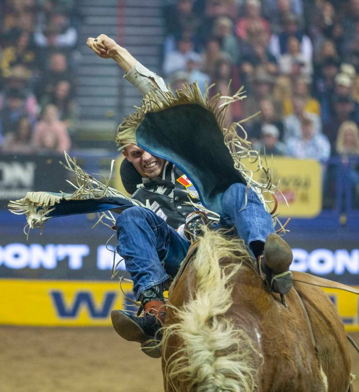 Orin Larsen of Inglis, Manitoba, rides Illegal smile in Bareback Riding during the third go-aro ...