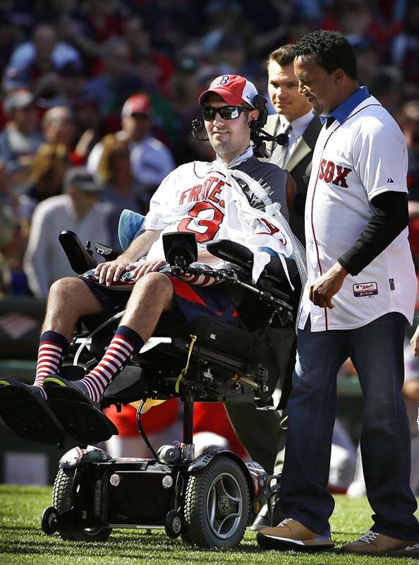 FILE - In this April 13, 2015, file photo, Pete Frates, center, former Boston College baseball ...