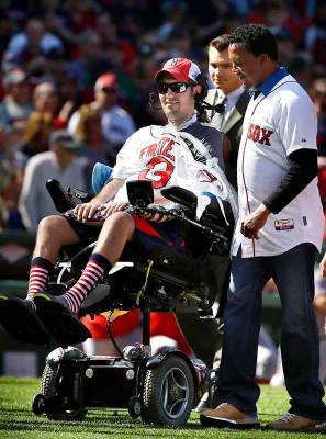 FILE - In this April 13, 2015, file photo, Pete Frates, center, former Boston College baseball ...