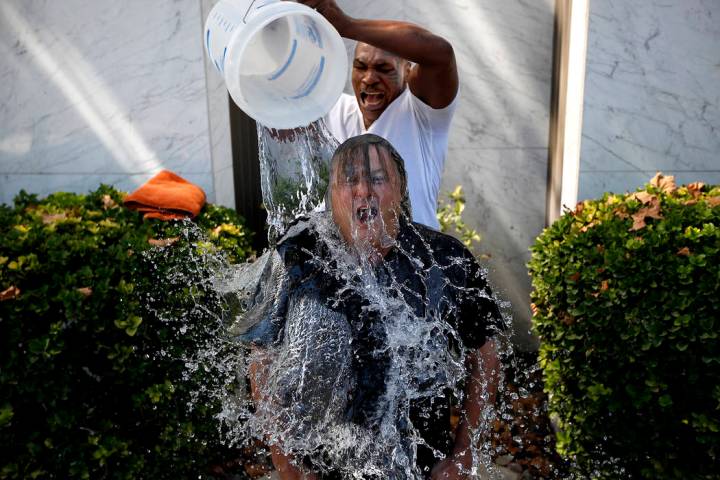 Mike Tyson dumps ice water on Las Vegas attorney David Chesnoff outside of Chesnoff's law firm ...