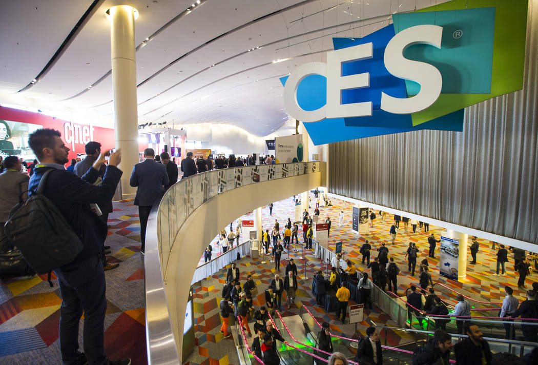 CES attendees make their way to the Sands Expo and Convention Center in Las Vegas, Jan. 9, 2019 ...