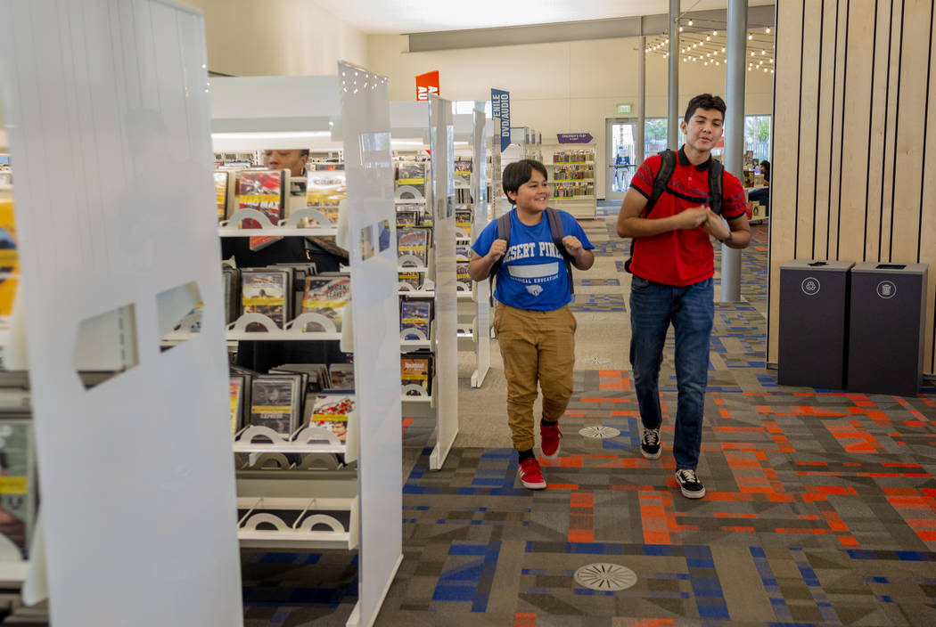 Desert Pines High School students Arturo Ramirez, 14, left, and Walter Enriquez, 16, walk throu ...