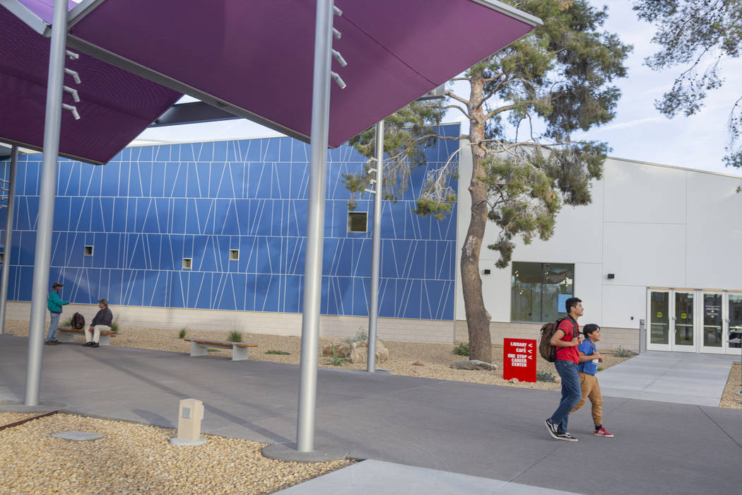 Desert Pines High School students Walter Enriquez, 16, left, and Arturo Ramirez, 14, and leave ...