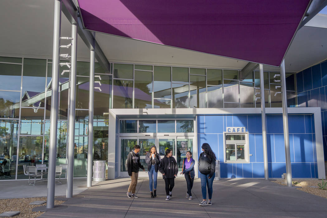 Martin Middle School friends leave the East Las Vegas Library in Las Vegas on Tuesday, Dec. 10, ...