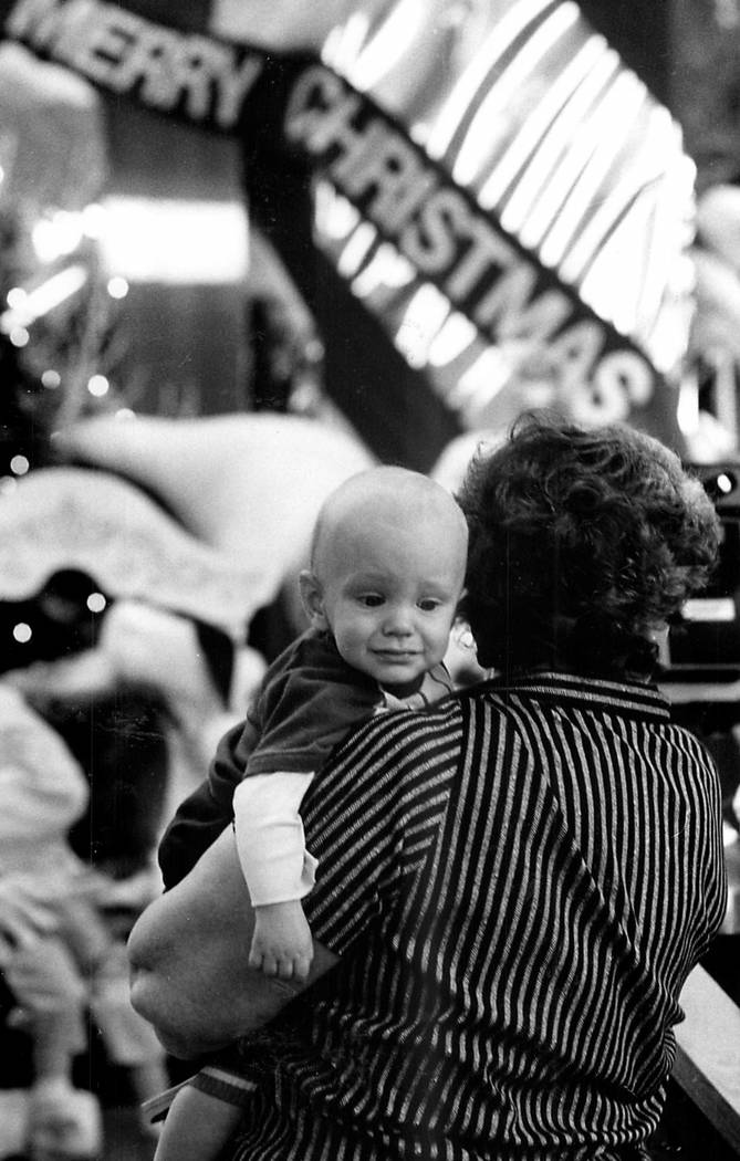 Rethinking it, this child isn't sure about seeing Santa in 1984 after all. Jim Laurie/Las Vegas ...