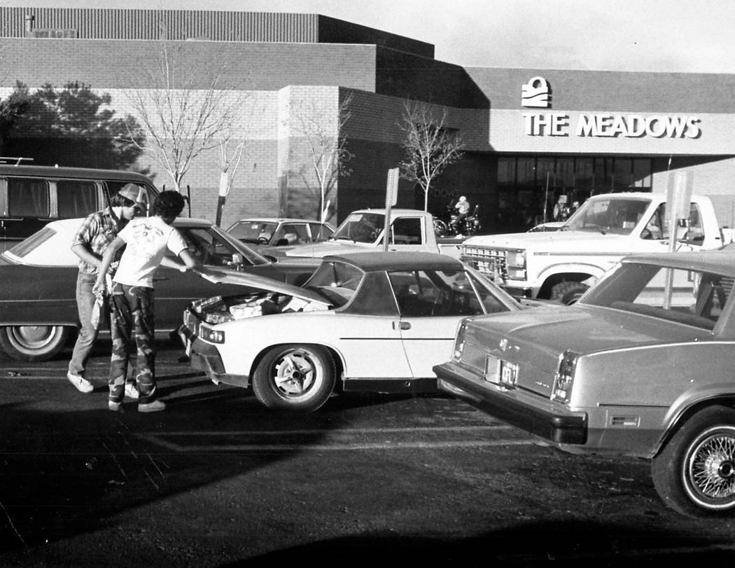 Shoppers at the Meadows mall stuff presents into an already stuffed trunk in 1981. Wayne C. Kod ...