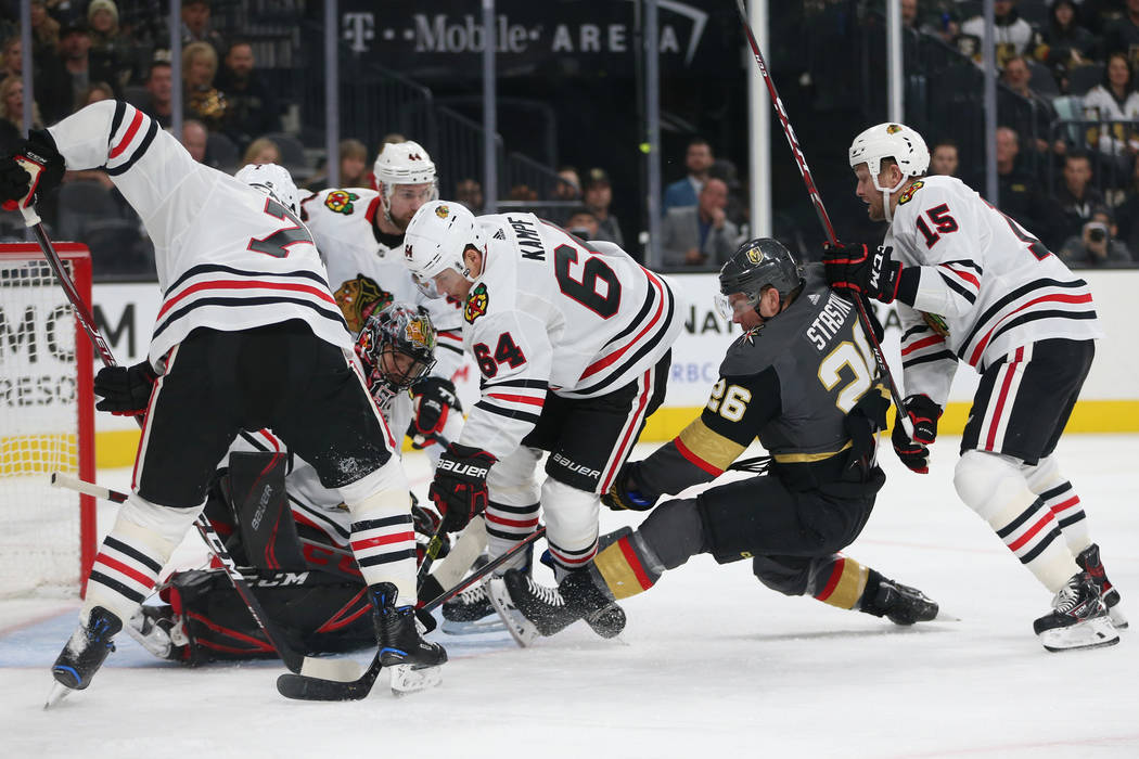 Vegas Golden Knights center Paul Stastny (26) battles for the puck against Chicago Blackhawks p ...