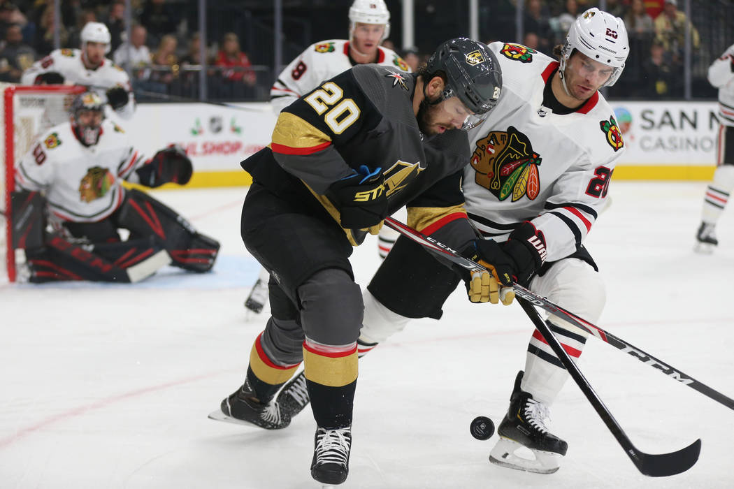 Vegas Golden Knights center Chandler Stephenson (20) and Chicago Blackhawks left wing Brandon S ...