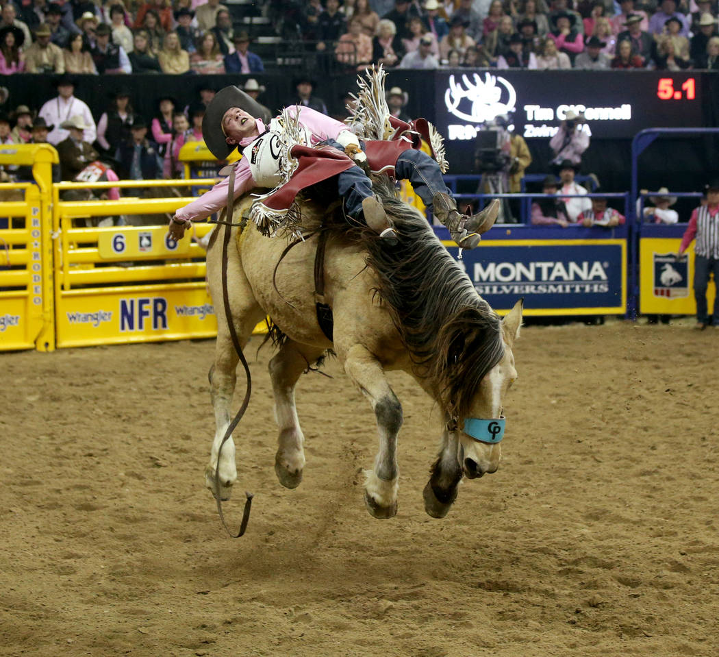 Tim O'Connell of Zwingle, Iowa rides Uncapped during Bareback Riding in the fifth go-around of ...