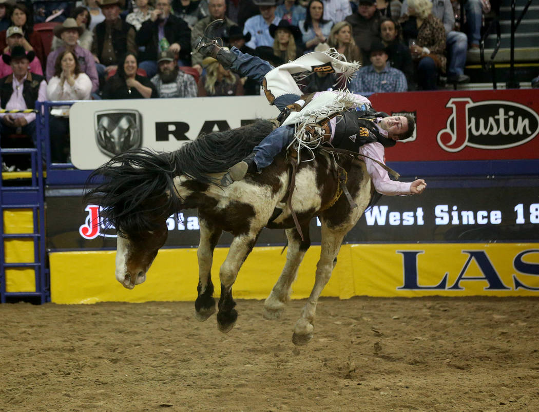 Kaycee Feild of Genola, Utah rides Life Jacket during Bareback Riding in the fifth go-around of ...