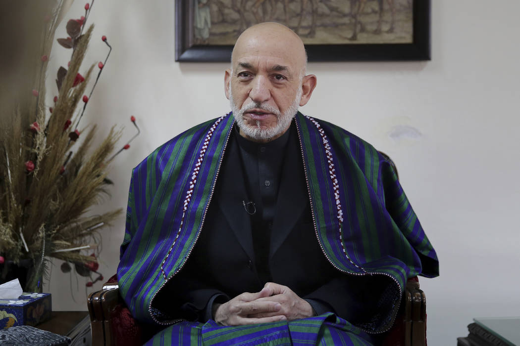 Former Afghan President Hamid Karzai speaks during an interview with The Associated Press, in K ...