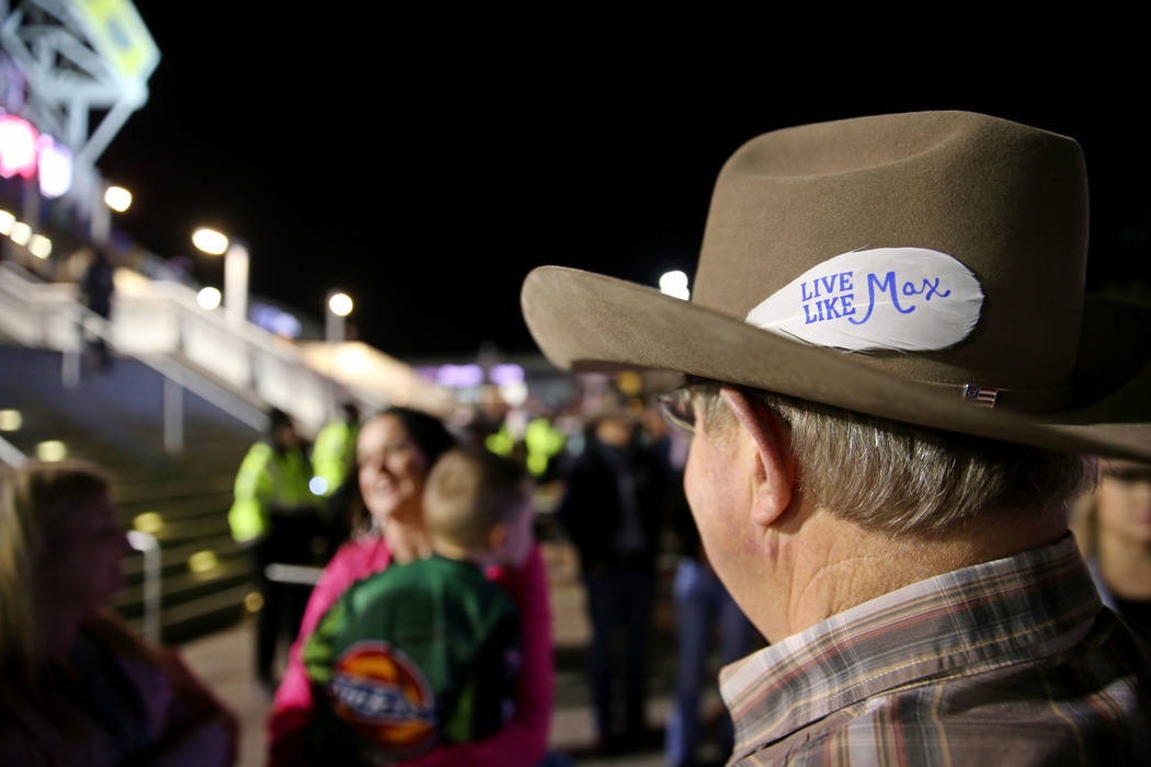 Jupe Allen dons a "Live Like Max" white feather as his daughter Missi Henderson, 43, ...