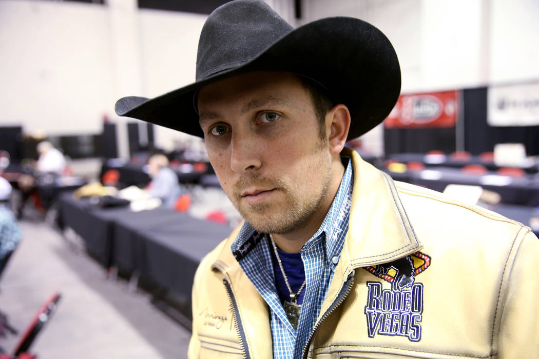 Steer wrestler Riley Duvall dons a "Live Like Max" white before the sixth go-round of ...