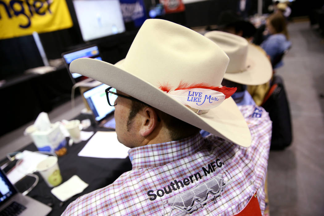 Roper Coleman Proctor of Pryor, Okla. dons a "Live Like Max" white before the sixth g ...