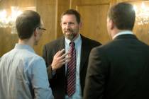 Former Montana Solicitor General Lawrence VanDyke, center, talks with law students Jason Collin ...