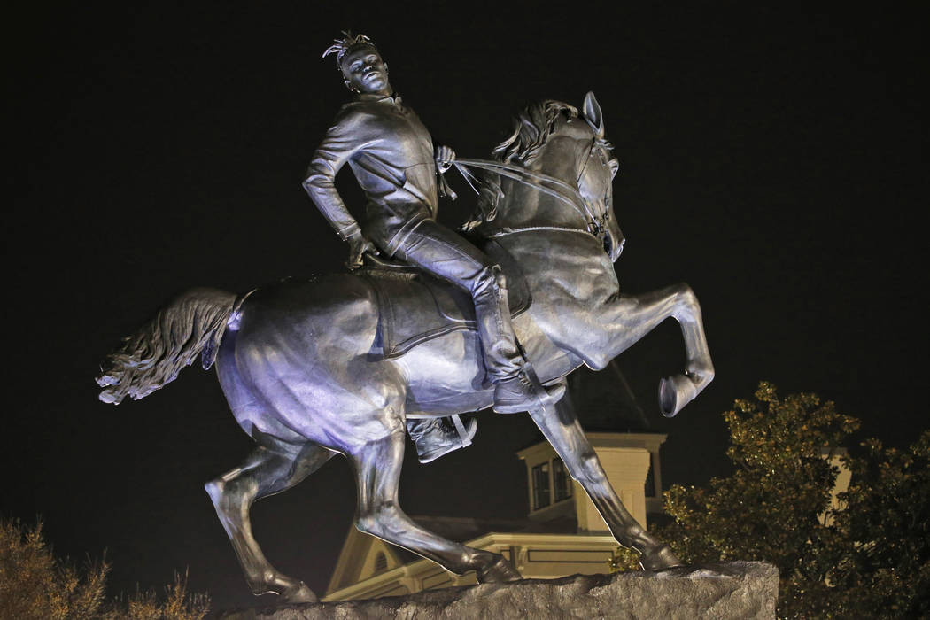 The statue titled Rumor's of War by artist Kehinde Wiley gets fully unveiled after the tarp cov ...