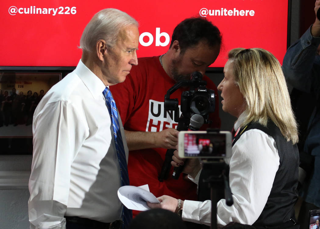 Democratic presidential candidate former Vice President Joe Biden talks with Barbie Tivas, a ba ...