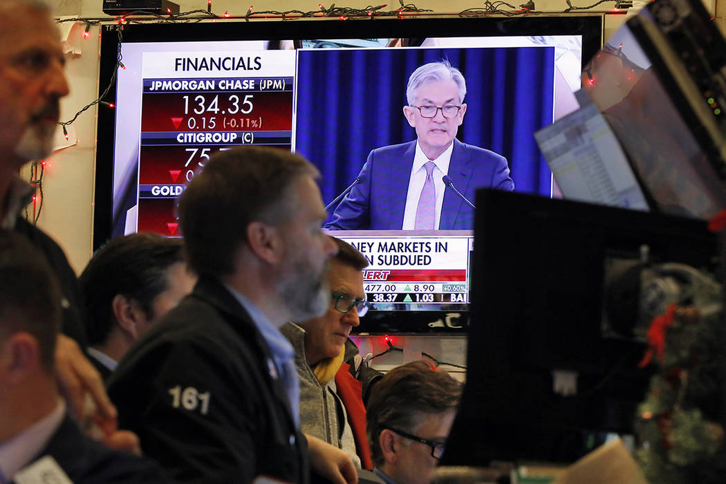 A television screen on the floor of the New York Stock Exchange shows Federal Reserve Board Cha ...