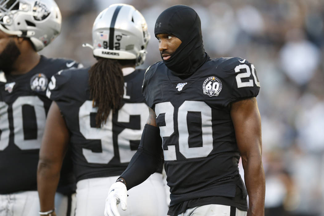 Oakland Raiders cornerback Daryl Worley (20), defensive tackle P.J. Hall (92), and defensive ta ...