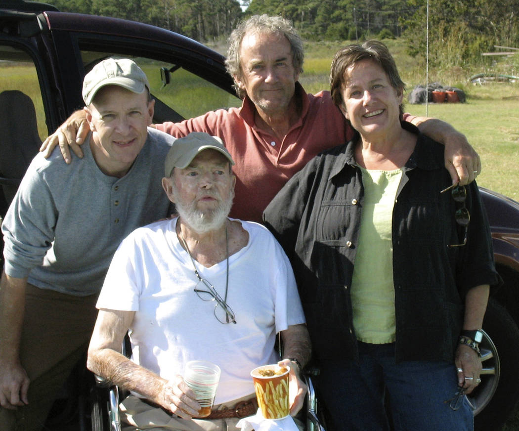 In this Sept. 29, 2009 photo provided by Betsy McNair, Robert McNair, center, poses with his ch ...