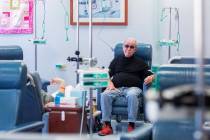 Fred Warnick, 73, the first patient in the world on a new lymphoma clinical trial, receives his ...