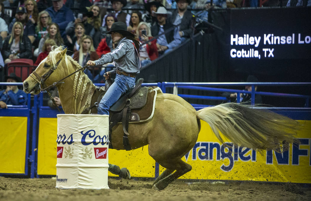 Hailey Kinsel of Cotulla, Texas, rounds a barrel on the way to a first place time of 13.60 seco ...