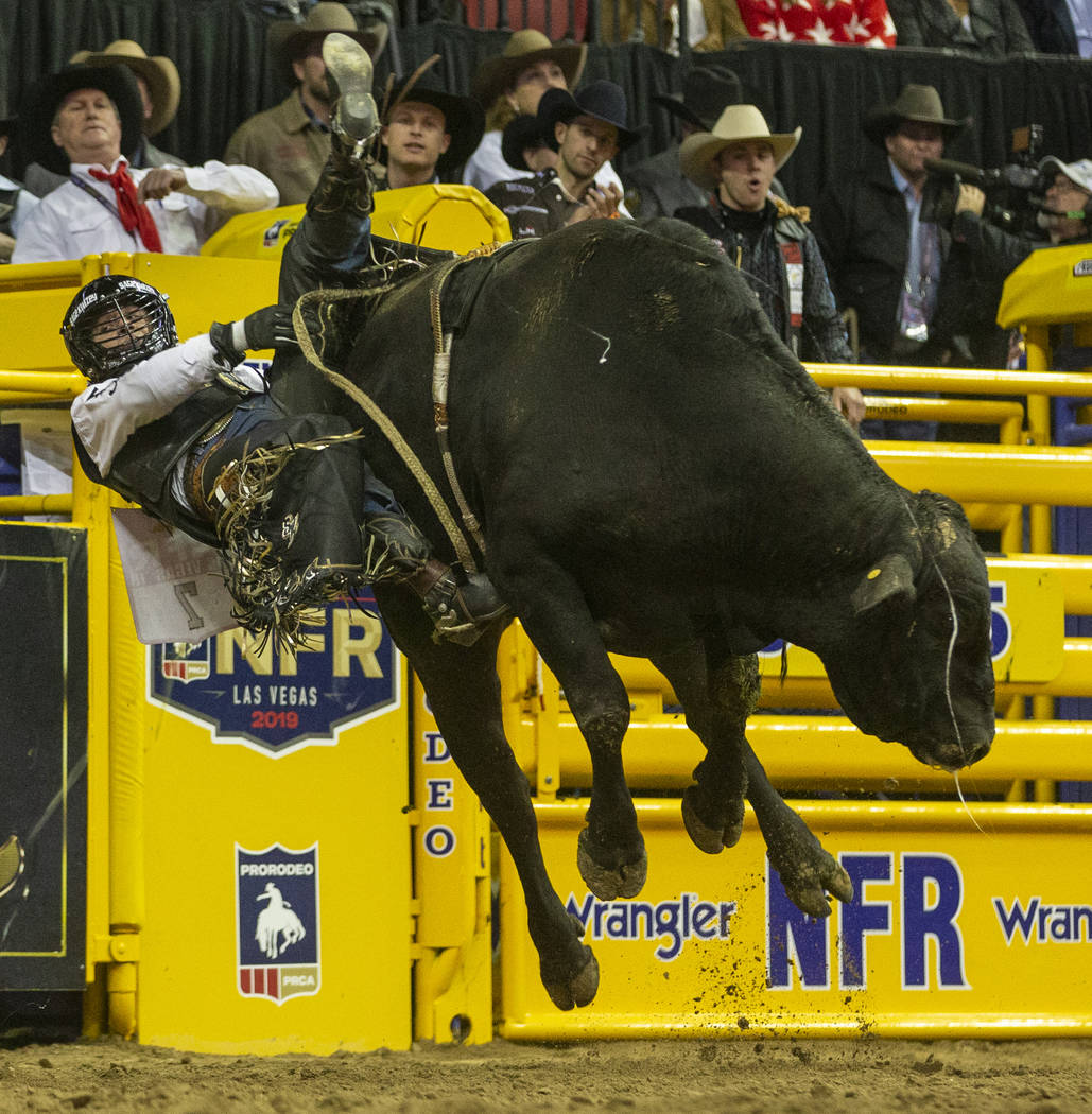 Sage Kimzey of Strong City, Okla., hangs on for time on Smoke Wagon for a first place score of ...